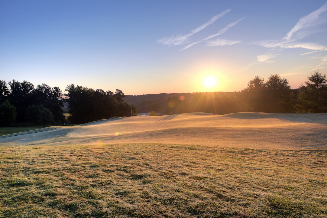 Professional Resort Photography and Video - Sun rising over the golf course warming the grass