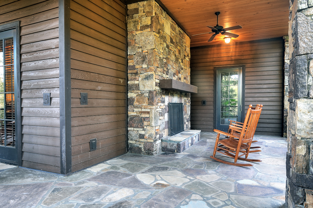 Professional Resort Photography and Video - Fireplace on porch at resort overlooks golf course